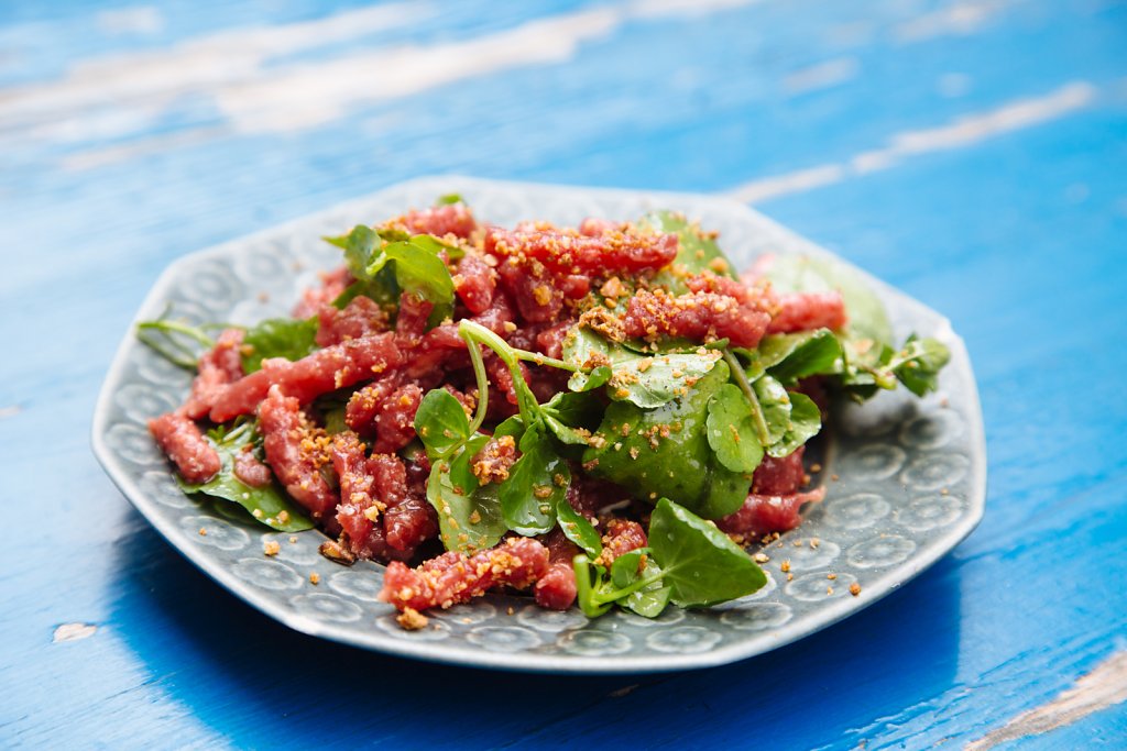 Beef tartare, with young cress, "egg cream" and crumbled rye-bread toasts